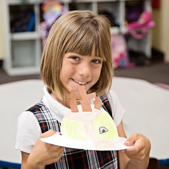 Student with art project