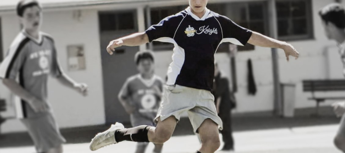 Student playing soccer
